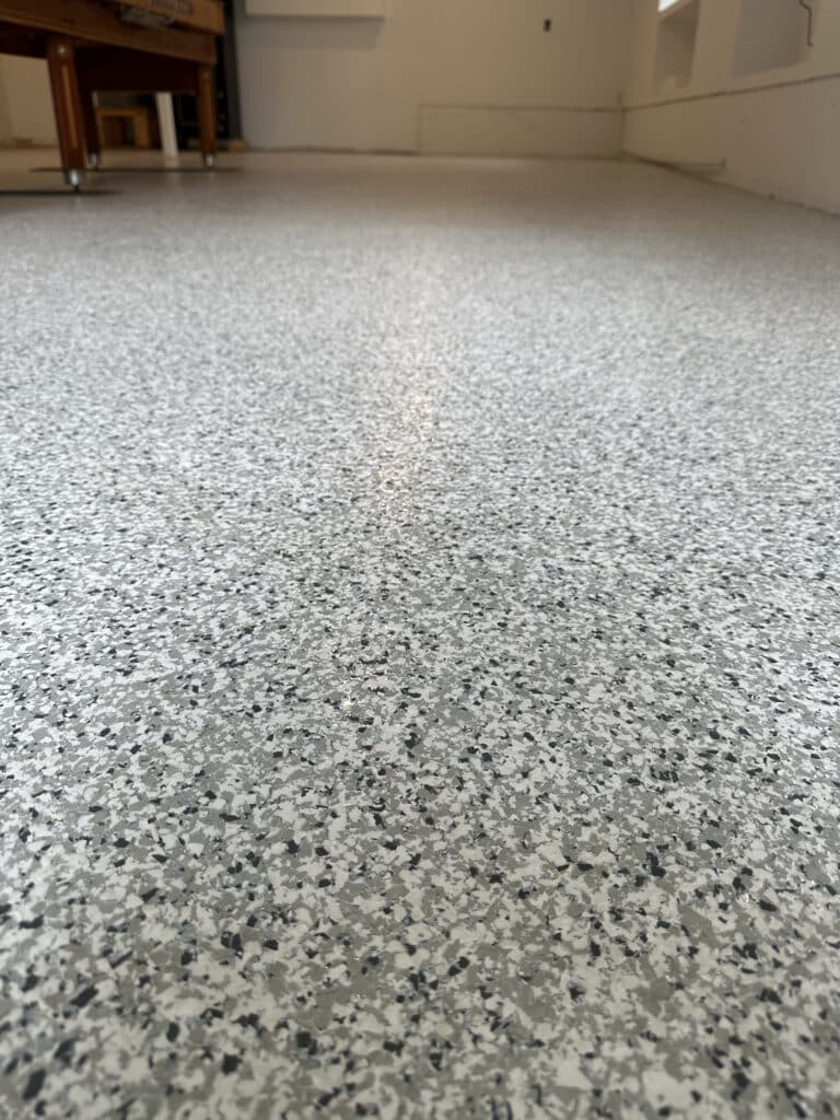 Basement floor with coated concrete